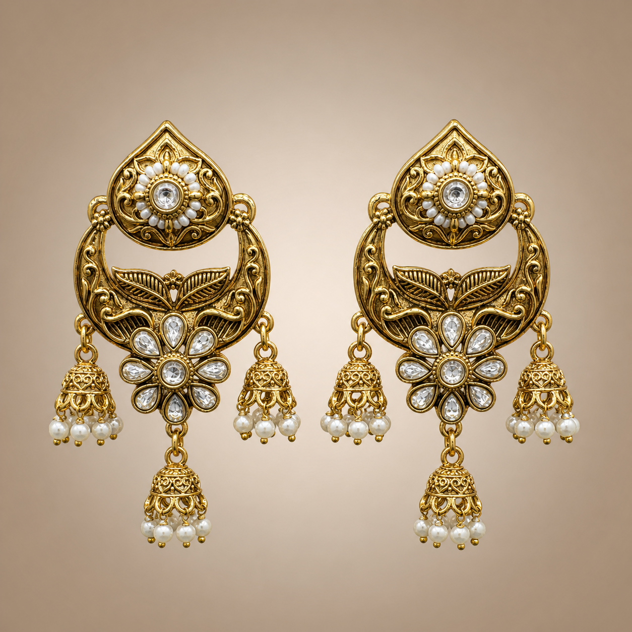 Antique gold chandbali triple jhumka earrings with clear stones and white pearl-like drops