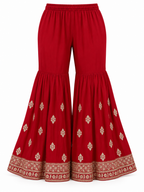 Crimson Red | Flared trousers with gold motifs and embroidered hem