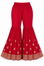 Rani Pink | Flared trousers with gold motifs and embroidered hem
