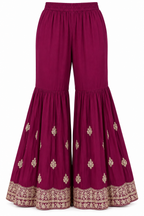 Wine Plum | Flared trousers with gold motifs and embroidered hem