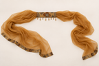 Sheer mustard scarf with an embroidered central neck panel, neck-panel beads and patterned fabric end borders.