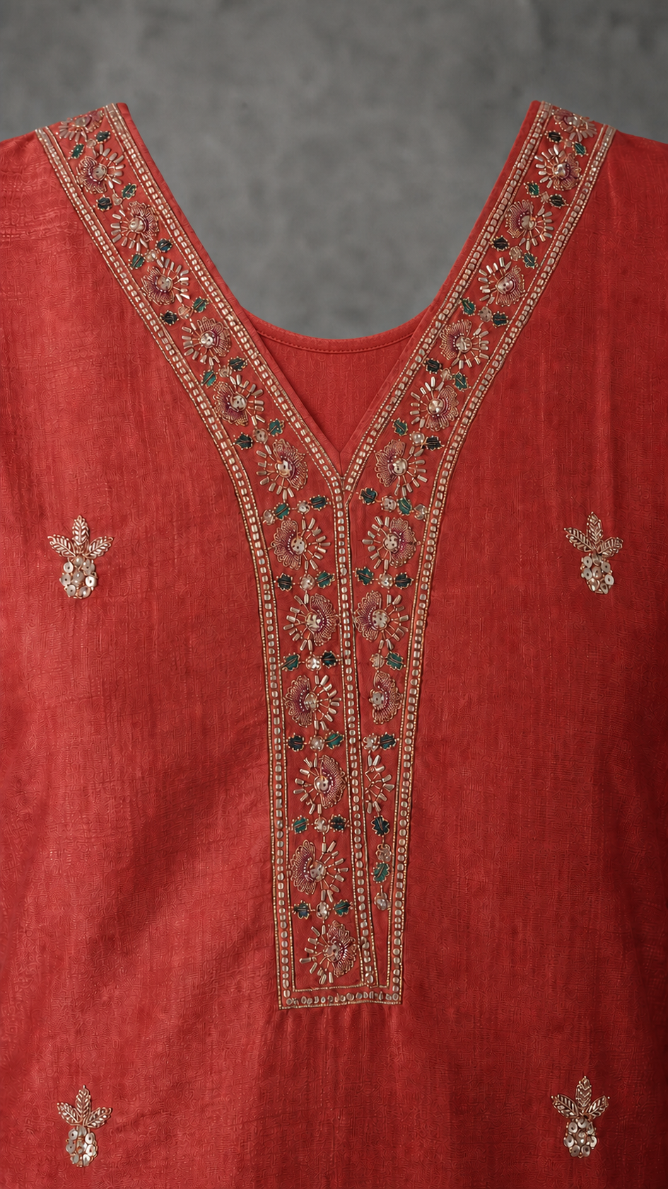 Deep Coral Red embroidered V neckline with visible rear neckline — detail